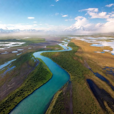 Aerial View of Turquoise River in Mountains
