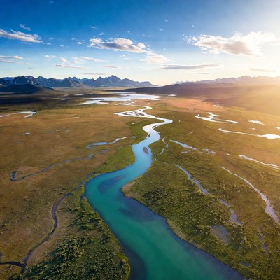 Aerial View of River in Mountain Valley