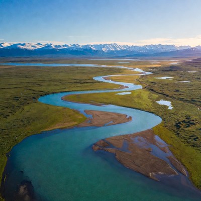 Aerial view of turquoise river in mountains