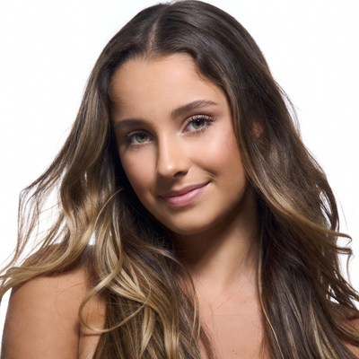 Smiling woman with wavy brown hair