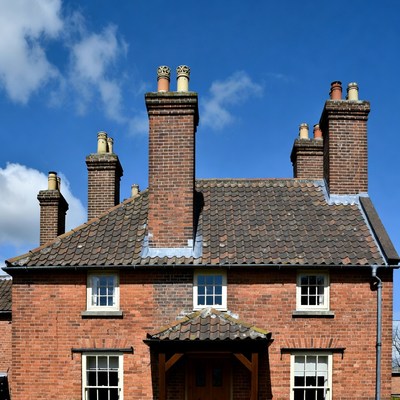 Brick house with multiple chimneys