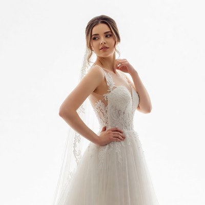 Bride in lace wedding dress with veil