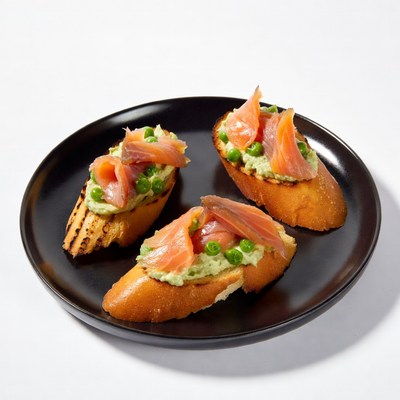 Smoked Salmon Pea Guacamole Toasts