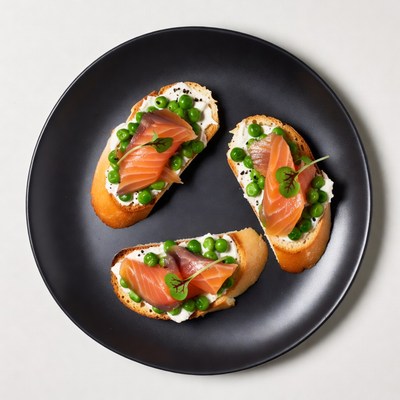 Salmon Pea Cream Toasts on Black Plate