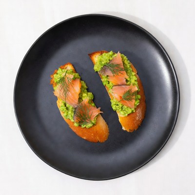 Salmon Avocado Toast on Black Plate