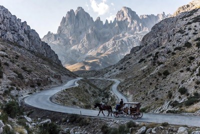 Horse-drawn cart on mountain road