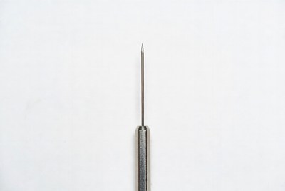 Metal Needle on White Background
