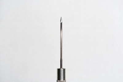 Metal Needle on White Background