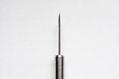 Sharp metal needle isolated