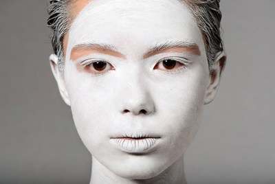 Asian woman with white kabuki makeup
