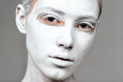 Woman with white face paint