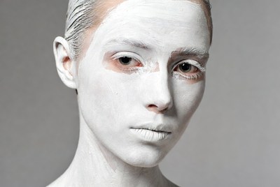 Woman with white face paint