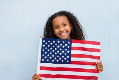 African-American girl holding American flag