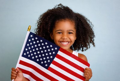 African-American girl holding American flag