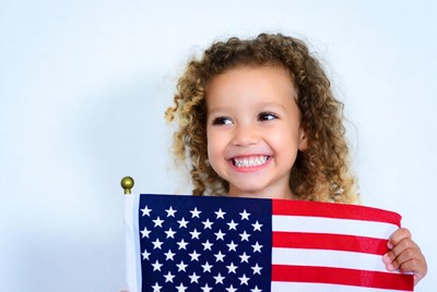 Curly-haired girl holding American flag