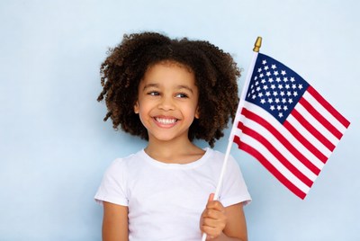 African-American girl holding American flag