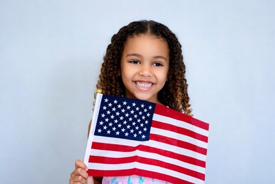 African-American girl holding American flag