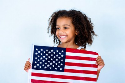 African-American girl holding American flag