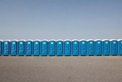 Row of Blue Portable Toilets