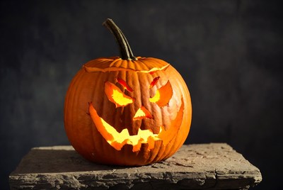 Lit Jack-o-Lantern on Stone Surface
