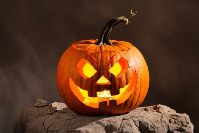 Lit Jack-o'-Lantern Pumpkin on Rock