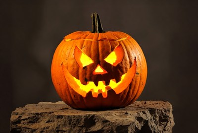 Lit Jack-o'-lantern on Stone