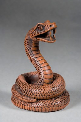 Coiled Brown Snake Sculpture