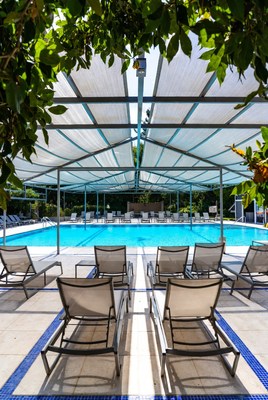 Empty Swimming Pool with Lounge Chairs