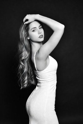 Woman posing in white dress