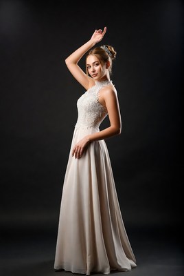 Woman in lace wedding gown posing