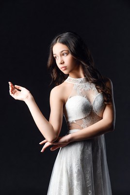 Young woman in white lace dress