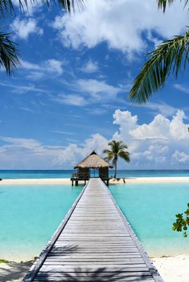 Wooden Pier to Beach Hut Over Turquoise Lagoon