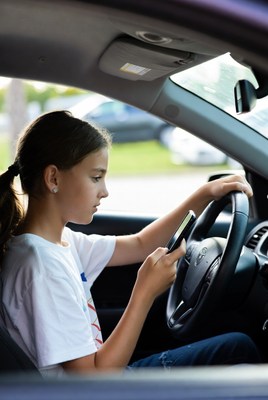 Girl texting while driving car