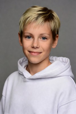 Boy with blonde hair in white hoodie