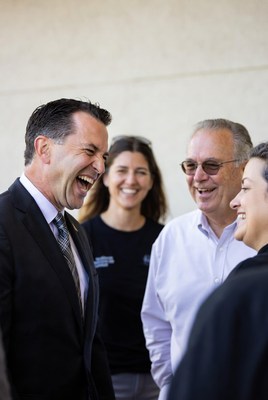 Group of four laughing together