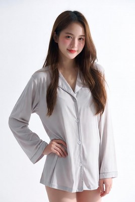 Asian woman in gray pajamas