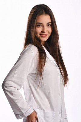 Smiling woman in white lab coat