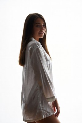 Silhouette of woman in white pajamas