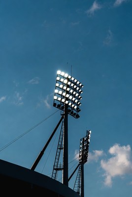 Floodlights on Stadium Poles at Dusk