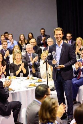 Man receiving award on stage