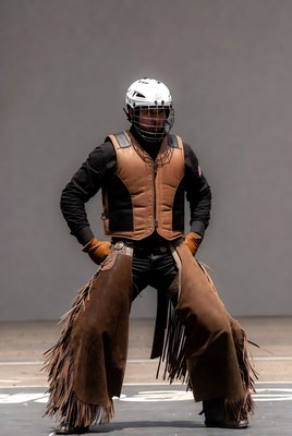 Cowboy posing in chaps and helmet