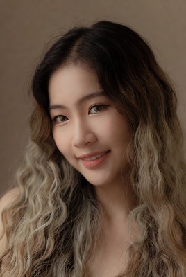 Asian woman with wavy balayage hair