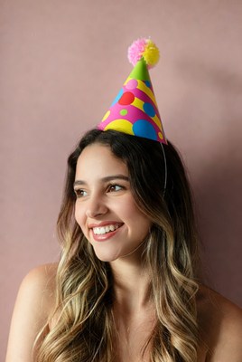 Smiling woman wearing party hat