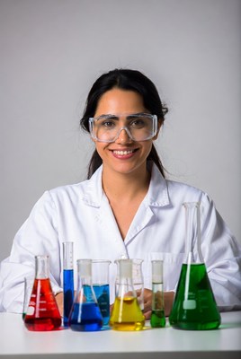 Woman scientist with colorful lab chemicals