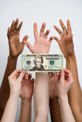 Hands Holding Twenty Dollar Bill