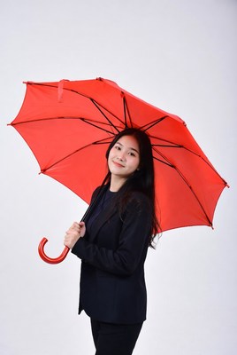 Asian woman holding red umbrella