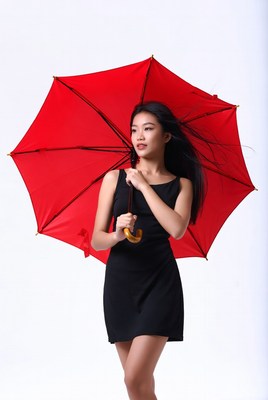 Asian woman holding red umbrella