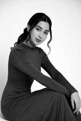 Beautiful woman in black turtleneck dress