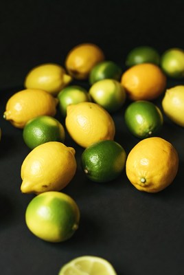 Fresh Lemons and Limes on Black Background
