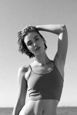 Woman posing with hand on head